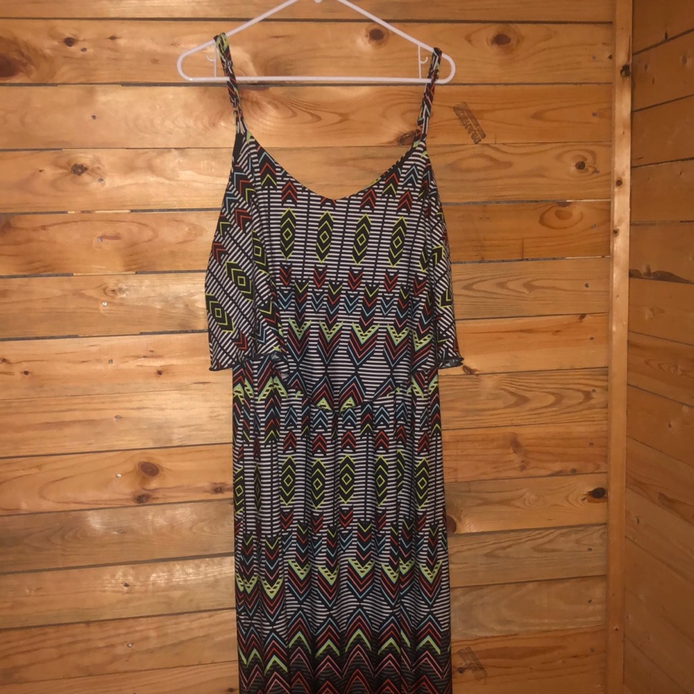 A black dress with stripes and multi colored arrow